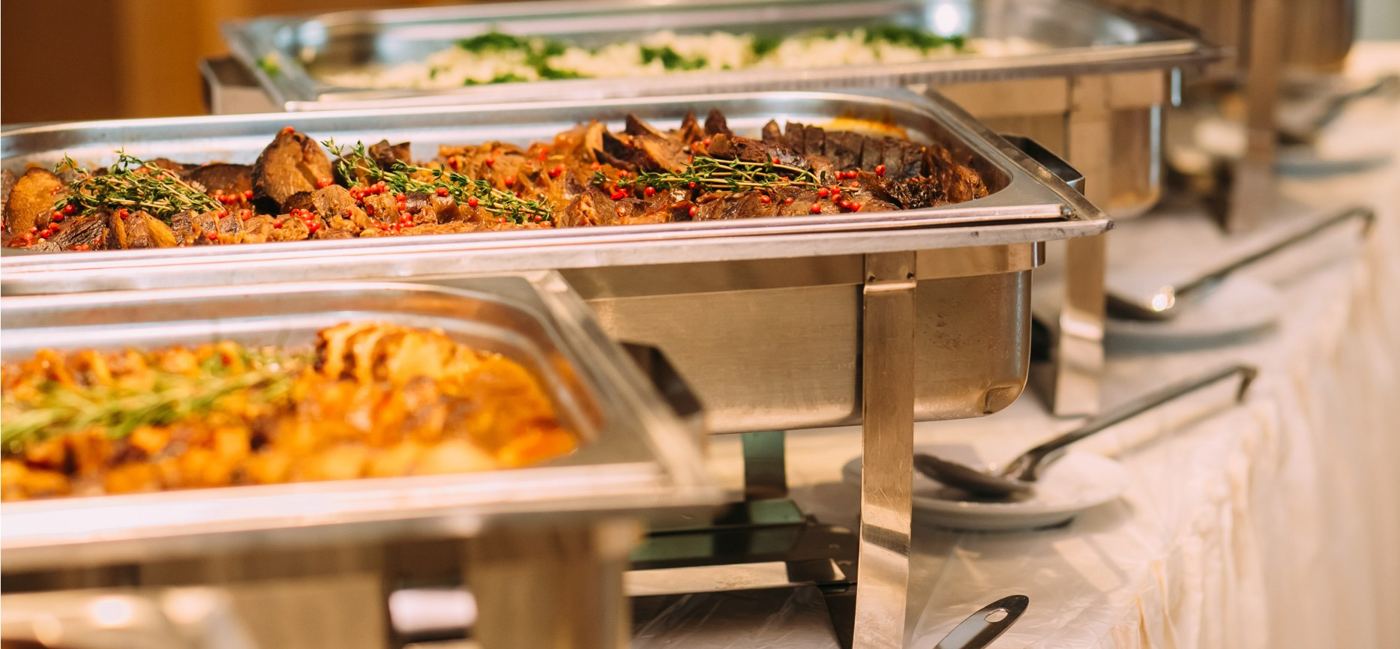 Hot dishes in chafing dishes on a buffet line